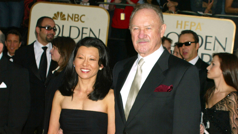 Gene Hackman in a suit and tie at an awards ceremony