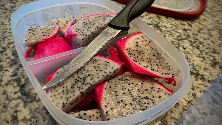 plastic container of sliced dragon fruit