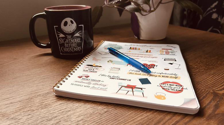 Notebook and coffee mug