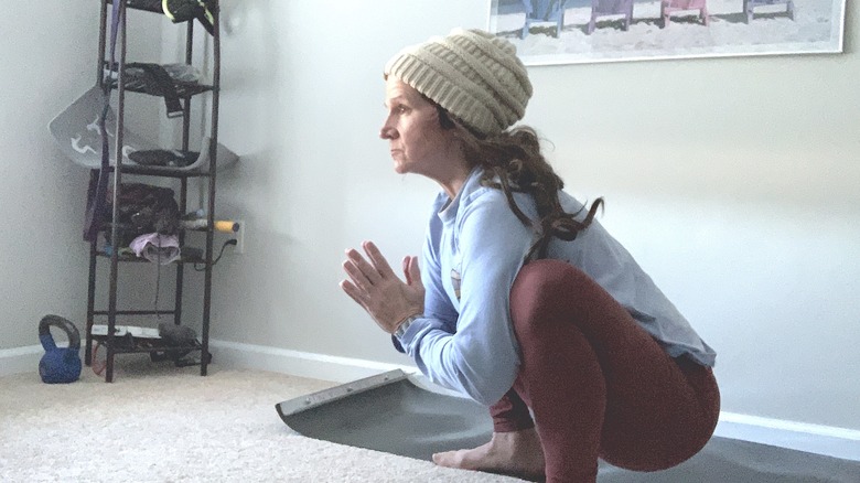 person performing yoga squat