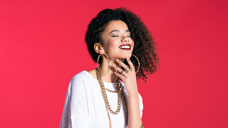 portrait of happy woman with a red background