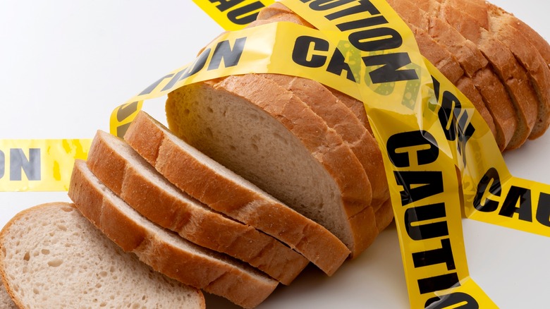 Sliced loaf of bread with caution tape