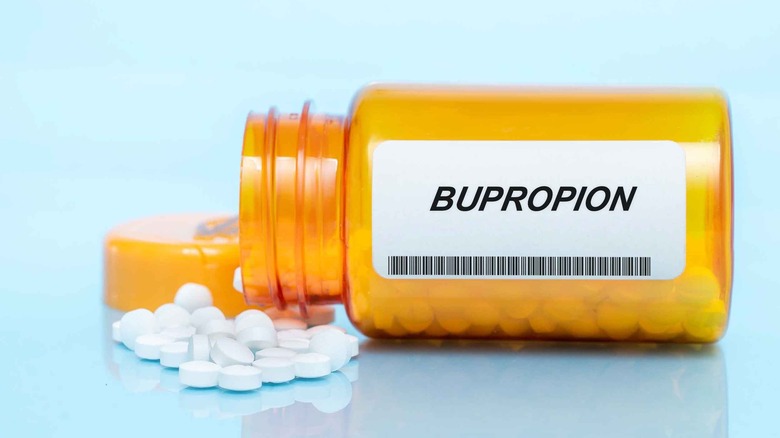 Spilled pill bottle with bupropion label