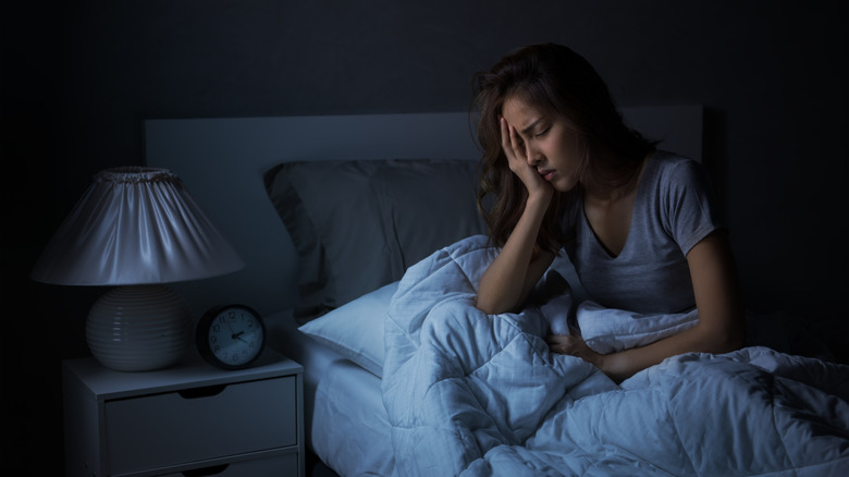 Distressed woman experiencing insomnia