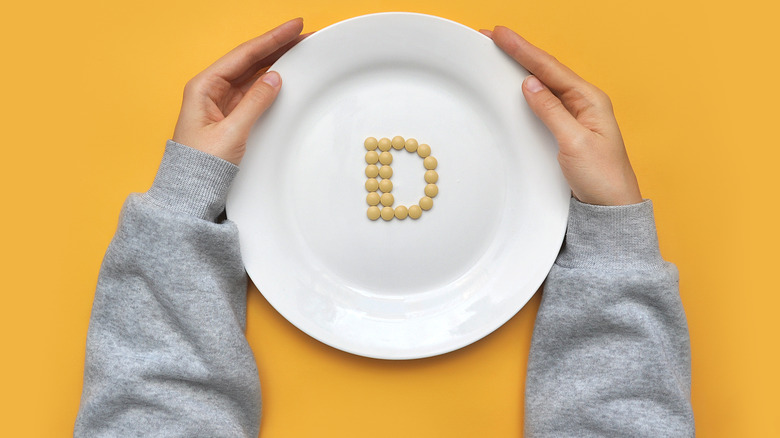 Vitamin D supplements on plate