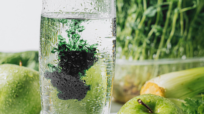 Chlorophyll dissolving in water with green veggies