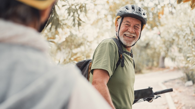 Man smiling on bicycle