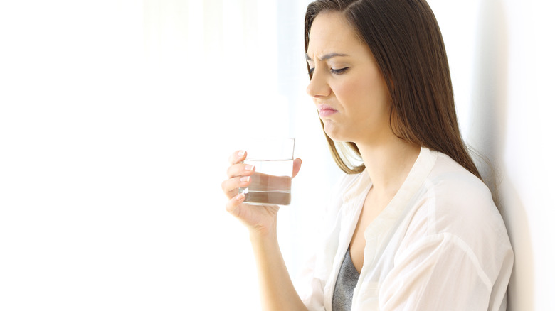 woman disgusted by drinking water