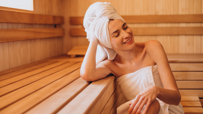 Woman sitting in sauna