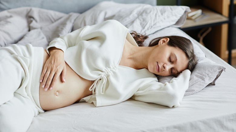 Pregnant woman sleeping on her side