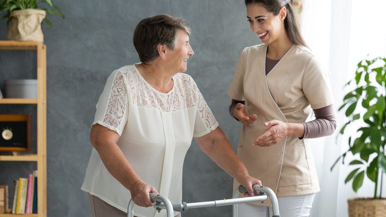 Woman with Parkinson's walking with walker