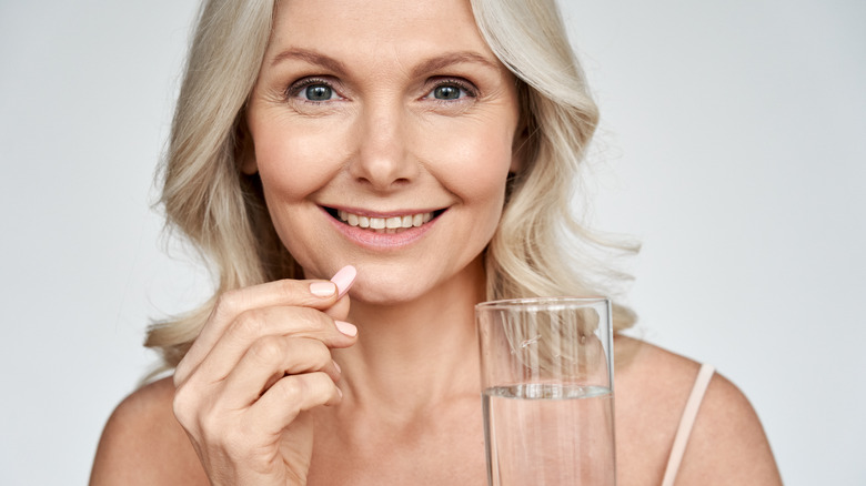 woman taking medications