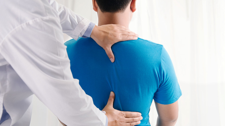 A man is treated for lower back pain