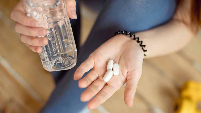 Woman taking calcium supplements 