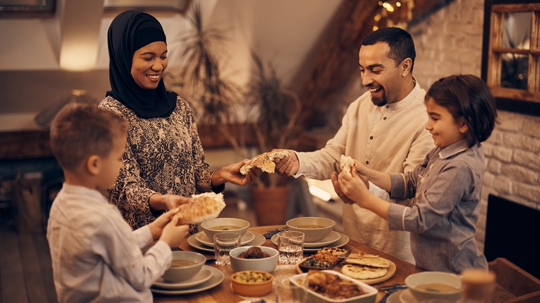 Muslim family eating food