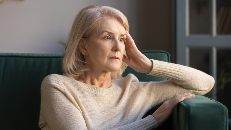 A woman with memory loss looks worried