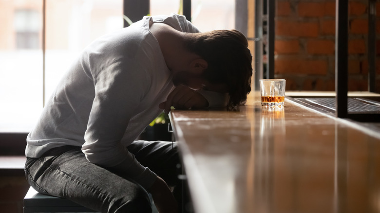 drunk man at bar