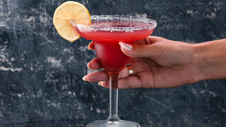 woman's hand holding margarita