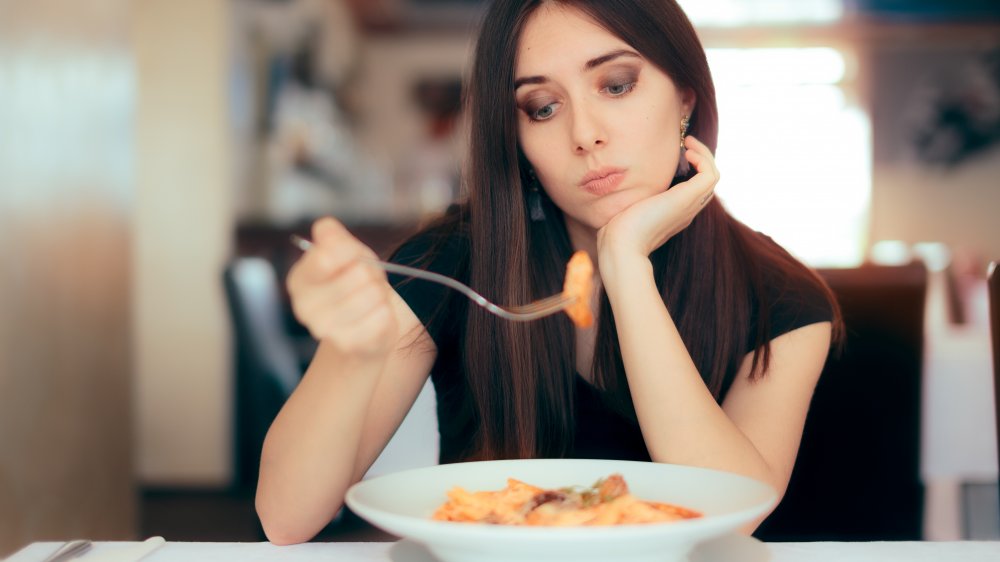 woman eating pasta