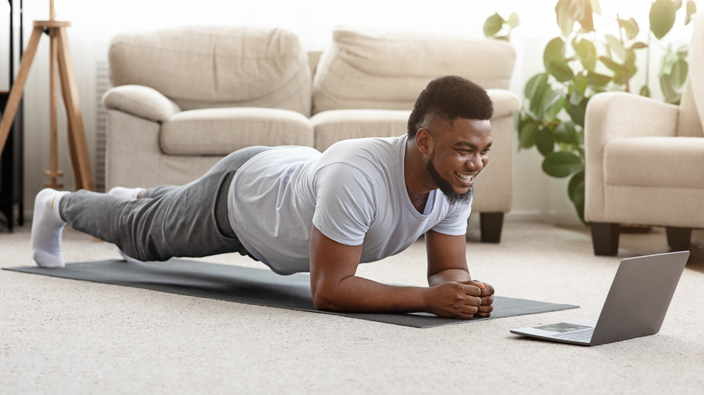 man doing a plank at home