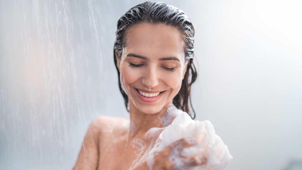 Woman soaping up in the shower