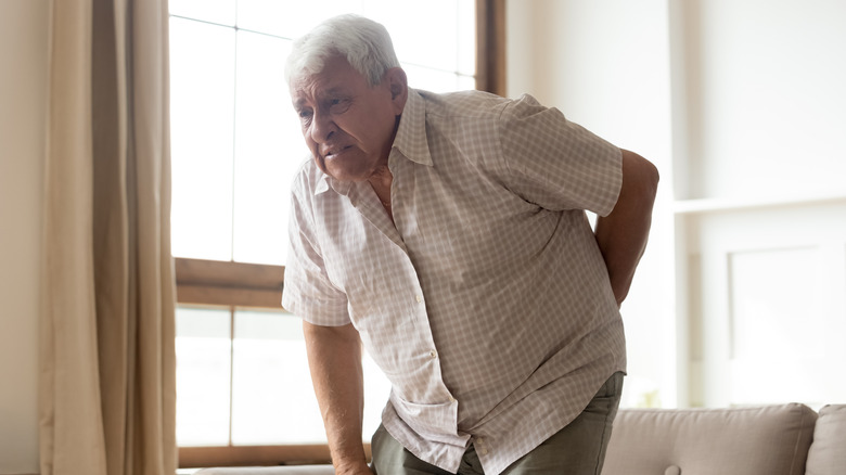 Man at home with joint pain