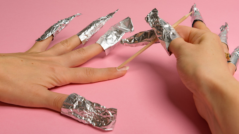 Removing gel manicure with foil and acetone