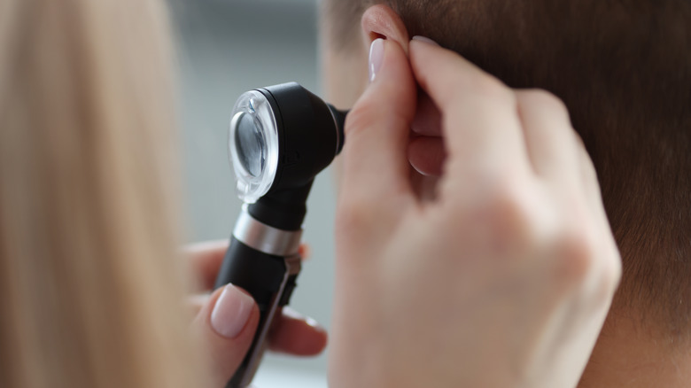 doctor checking ear