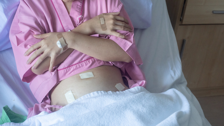 Hysterectomy patient lying in hospital bed