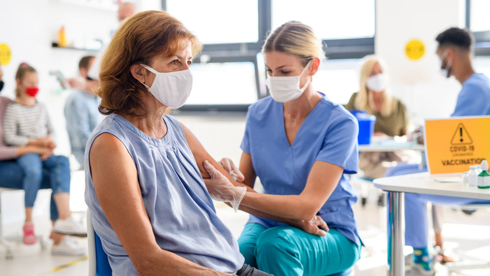 Woman getting COVID-19 vaccine