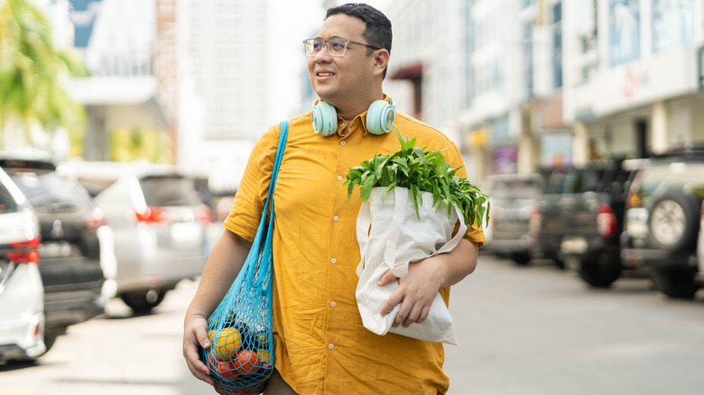 man holding groceries