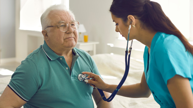 doctor with elderly patient
