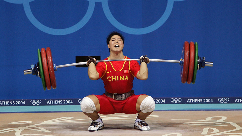 chinese weight lifter squatting