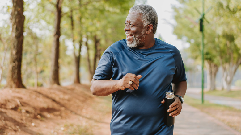 older man running in the park