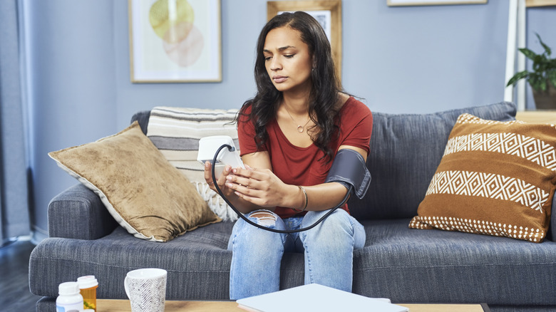 Woman checking blood pressure