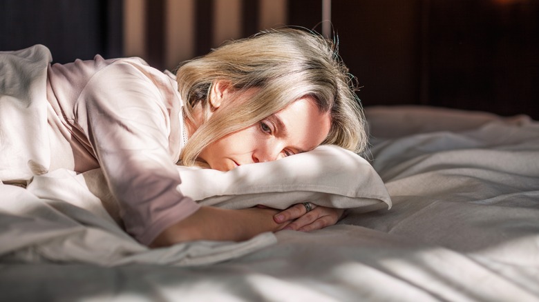 Woman in bed unable to sleep