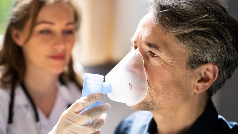 Man breathing with supplemental oxygen