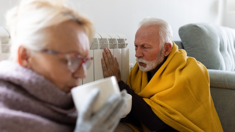 Cold elderly couple without heat