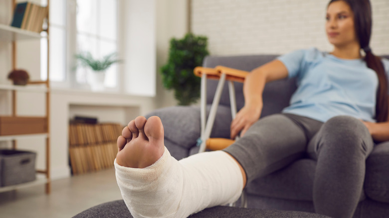 woman with broken ankle in cast