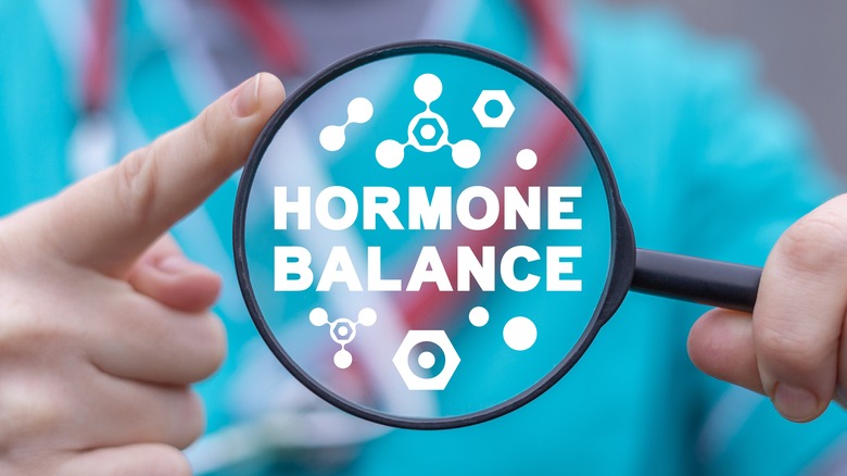 hormone balance written on magnifying glass