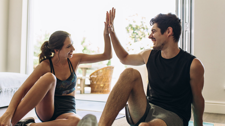 Happy couple resting after workout