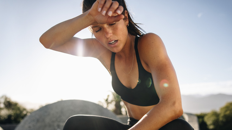 Woman tired from workout outdoors