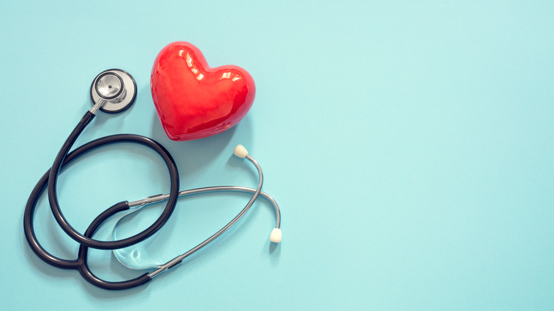 heart shaped object with stethoscope on blue background