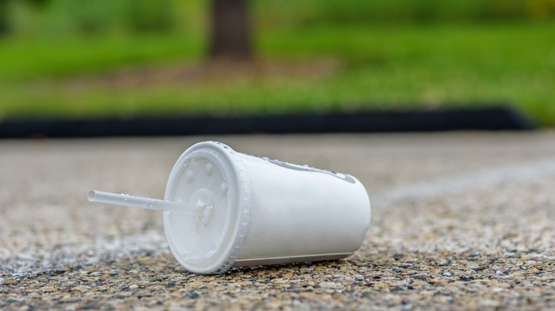 empty paper cup with a straw