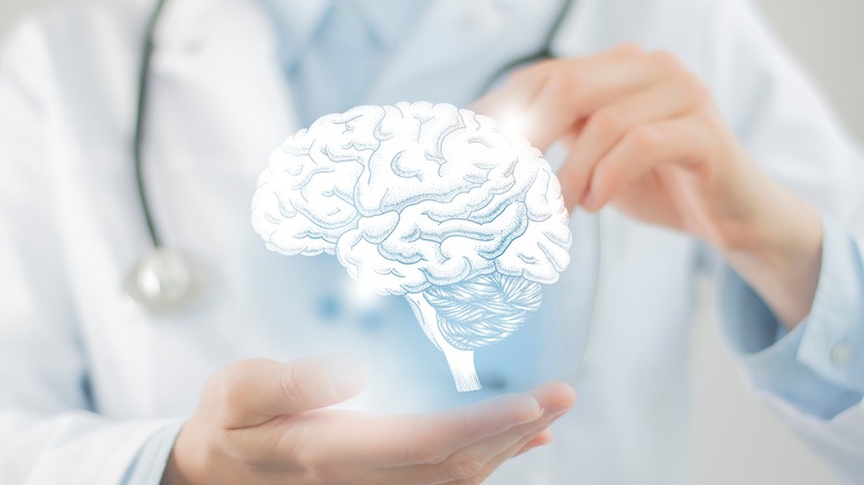 Doctor "holding" an image of a brain