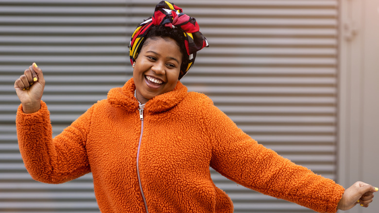 Woman dancing and smiling