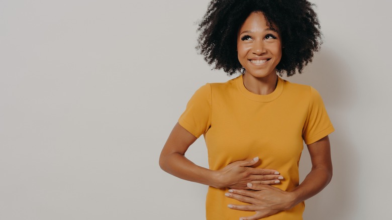 a person holding their stomach 