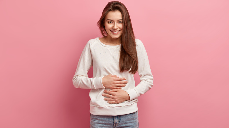 woman holding stomach