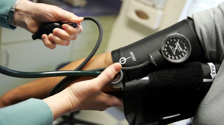 taking blood pressure with cuff