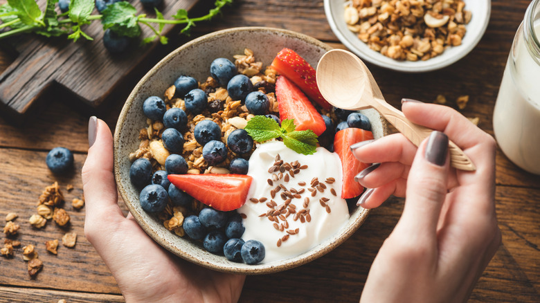 Granola, fruit, and yogurt in a bowl